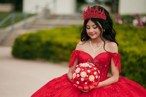 Red quinceañera dress portraits showcasing intricate details against natural outdoor backgrounds.