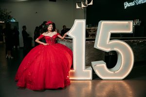A collection of photos showing a red quinceañera dress and illuminated number 15 decorations at a celebration event.