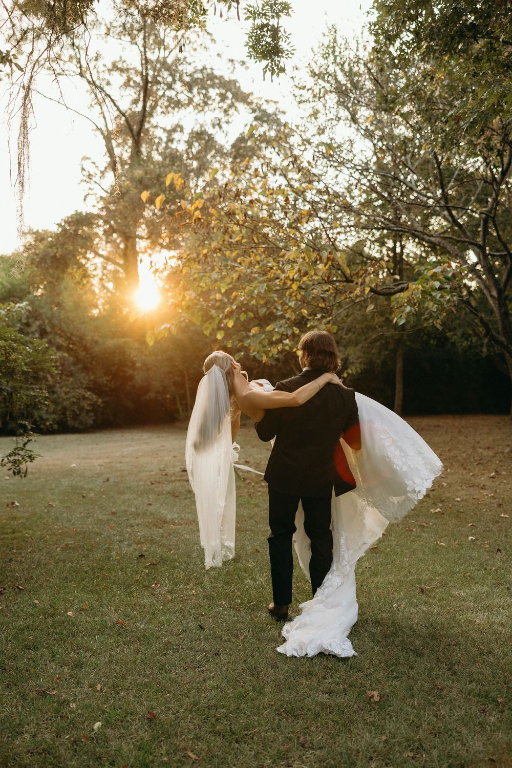 A couple dances playfully during wedding portraits at The Elms of Coosada in Coosada, Alabama