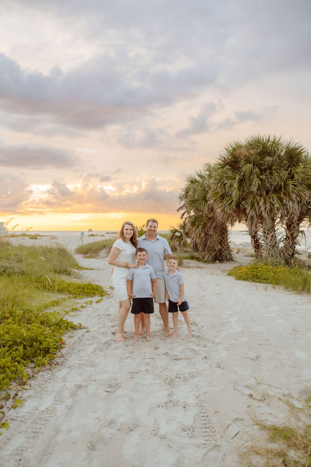Family walking together on a path during a sunset lifestyle photography session.