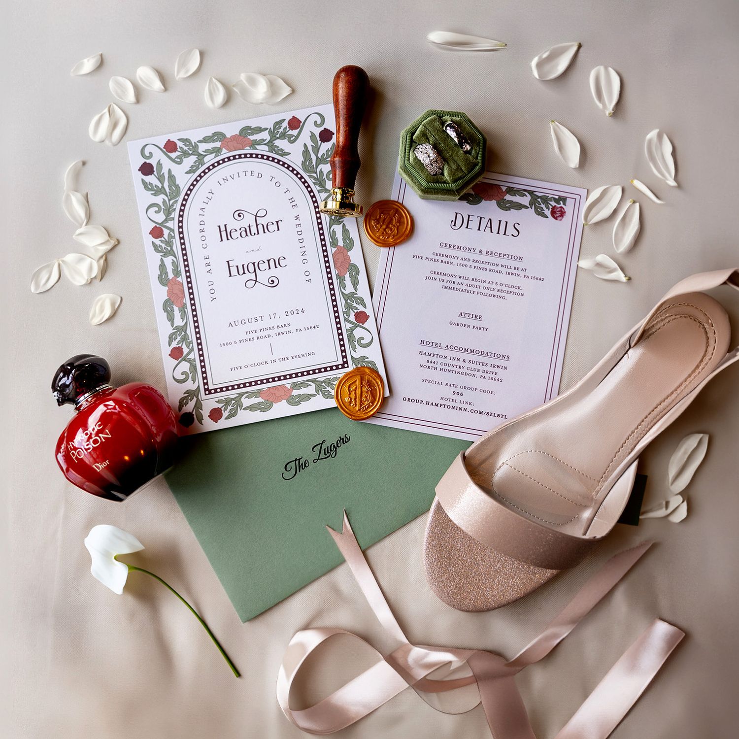 Wedding invitation details with floral design, nude heels, and scattered rose petals on a light background. Pittsburgh Weddings