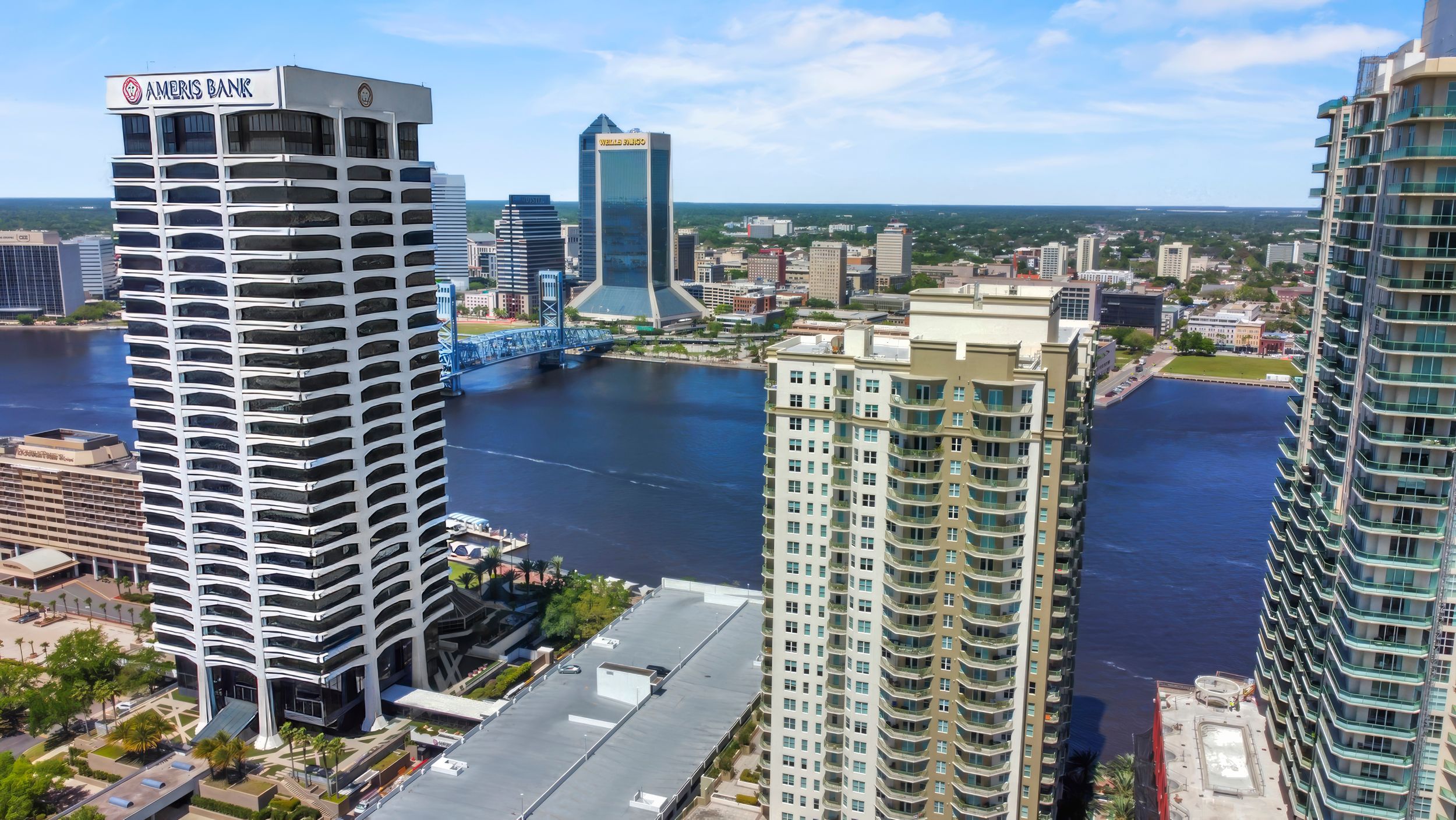 Aerial view of modern high-rise buildings and condominiums along the St. Johns River in downtown Jacksonville, Florida.