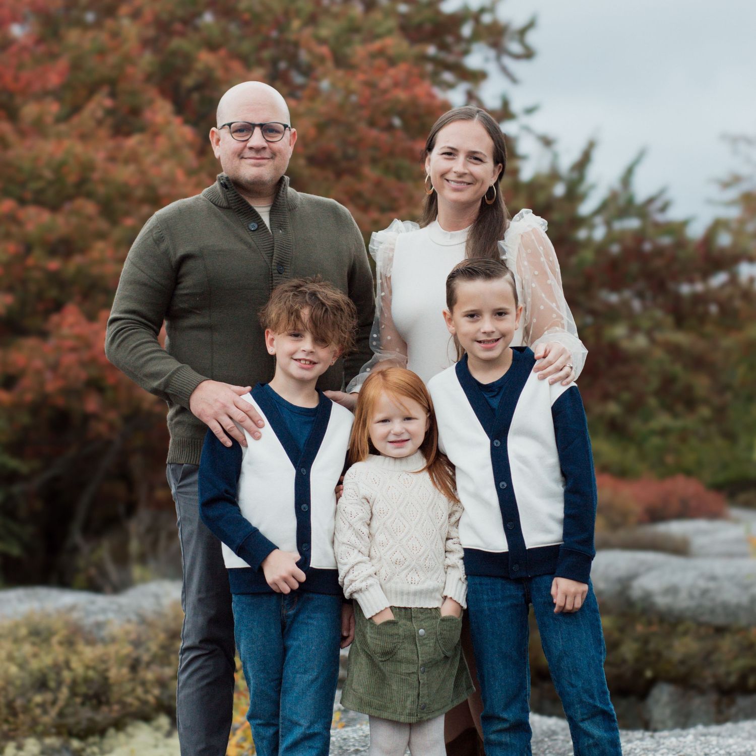 A family of five smile for fall photos at Rock City Park in Olean, NY. Captured by M. Rose Photography.