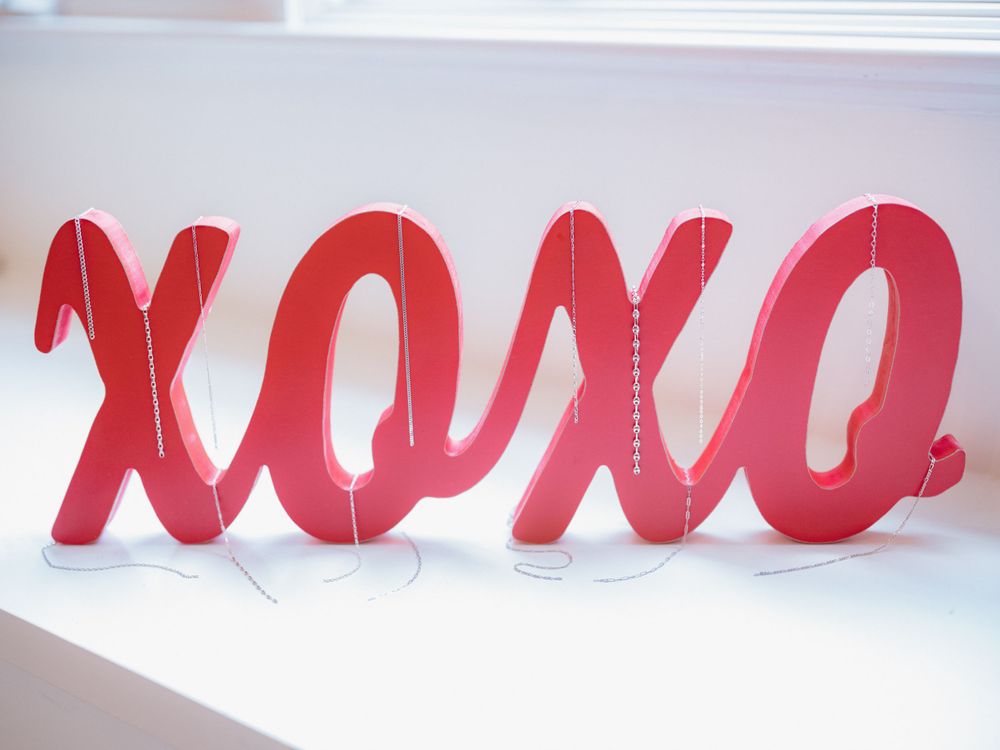 Red XOXO decorative text display in cursive style lettering.