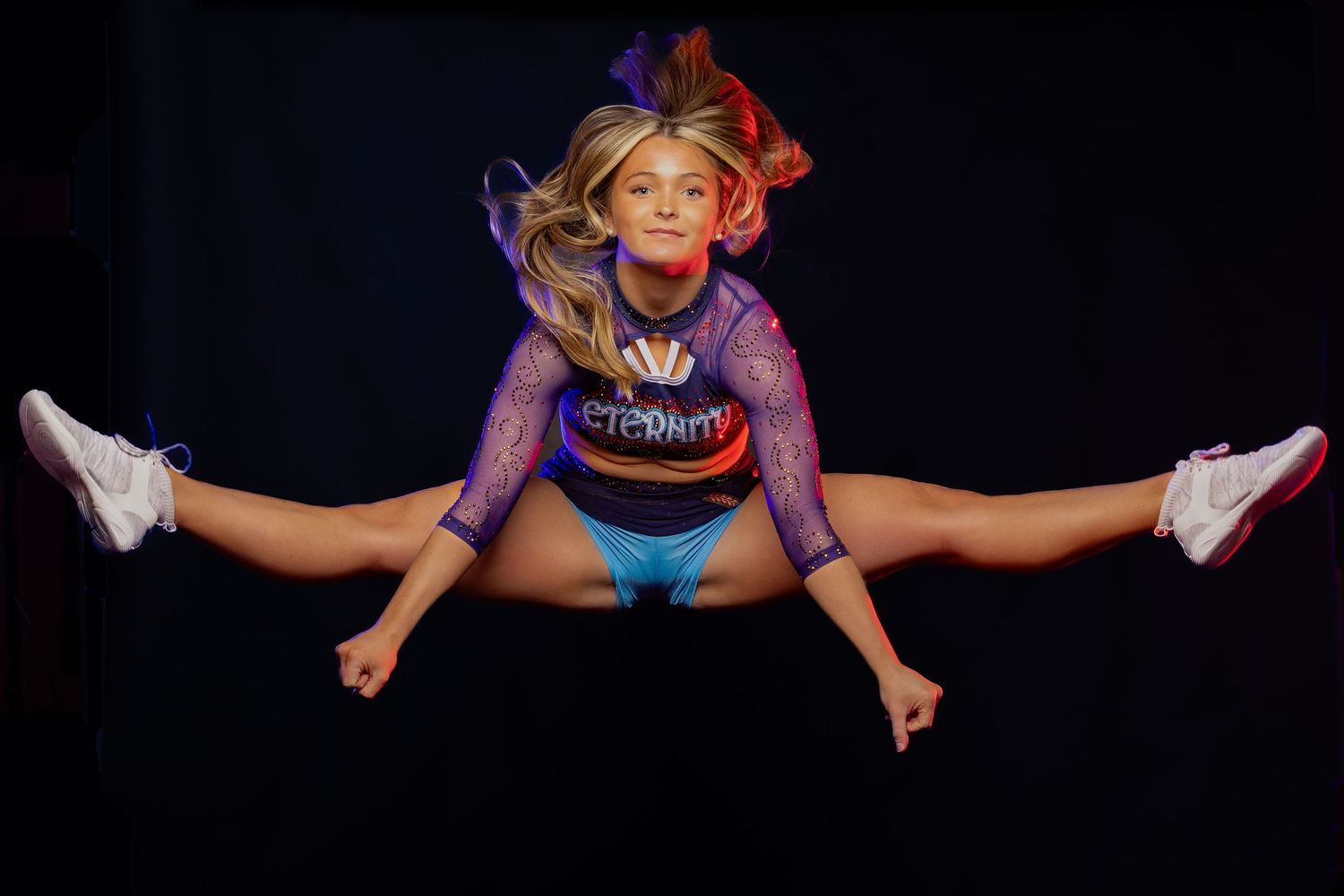 Gymnast performing split jumps in sequence showing progressive movement in purple athletic wear.