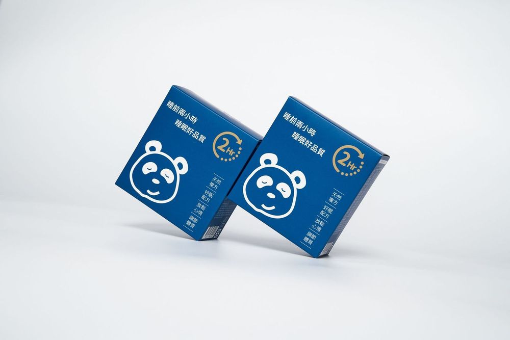 Blue business cards with panda logo designs shown from different angles against white background.