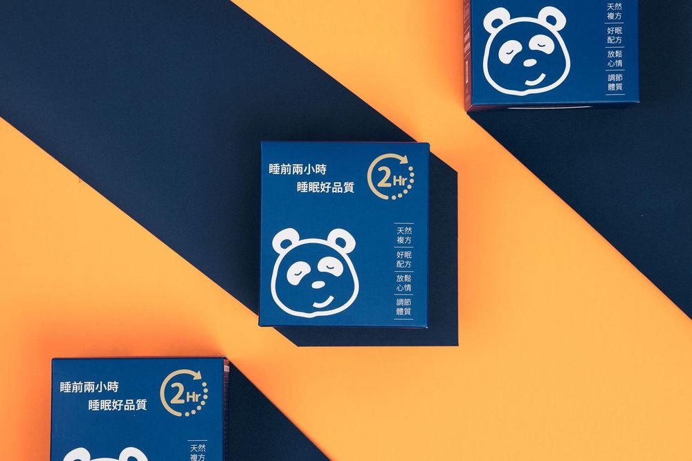 Diagonal arrangement of blue rectangular cards with panda bear icons against an orange background.