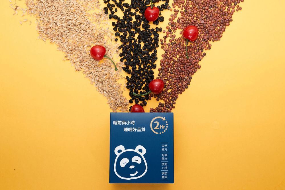 Credit cards scattered among coffee beans and red berries on a warm beige background.