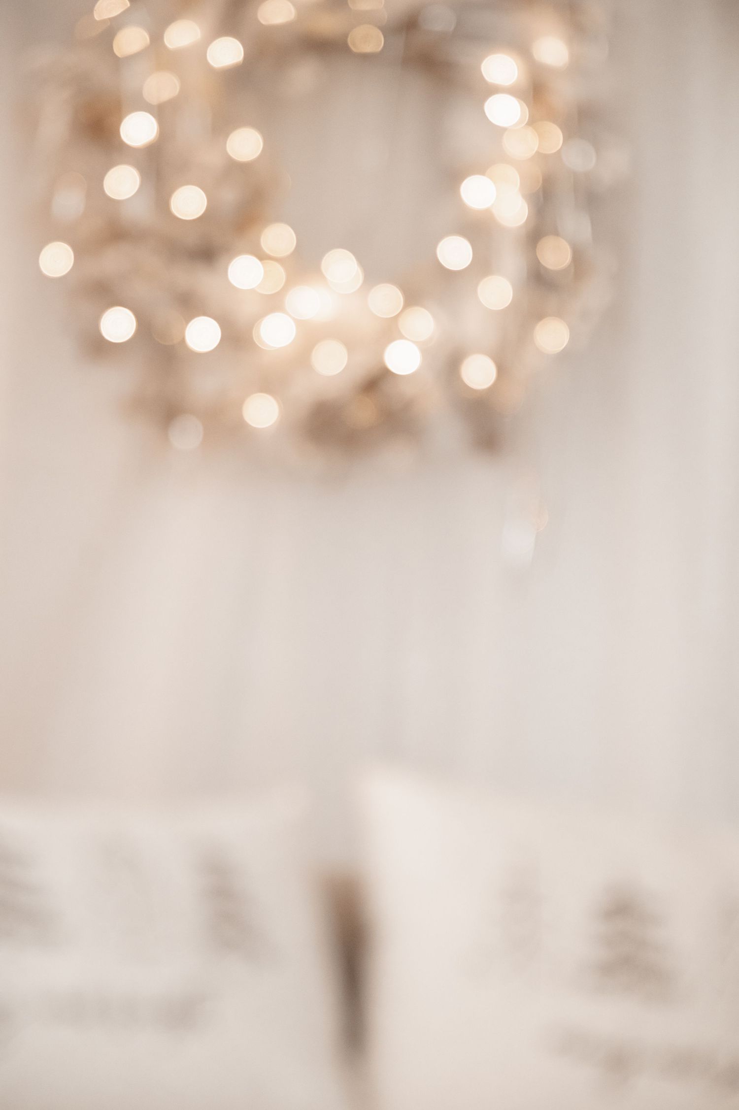 Abstract blurred background with soft golden bokeh lights creating a dreamy, festive atmosphere.