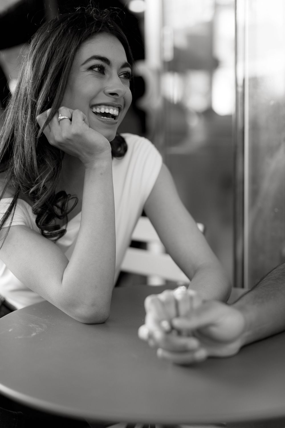 Series of candid black and white shots showing joyful expressions and laughter.