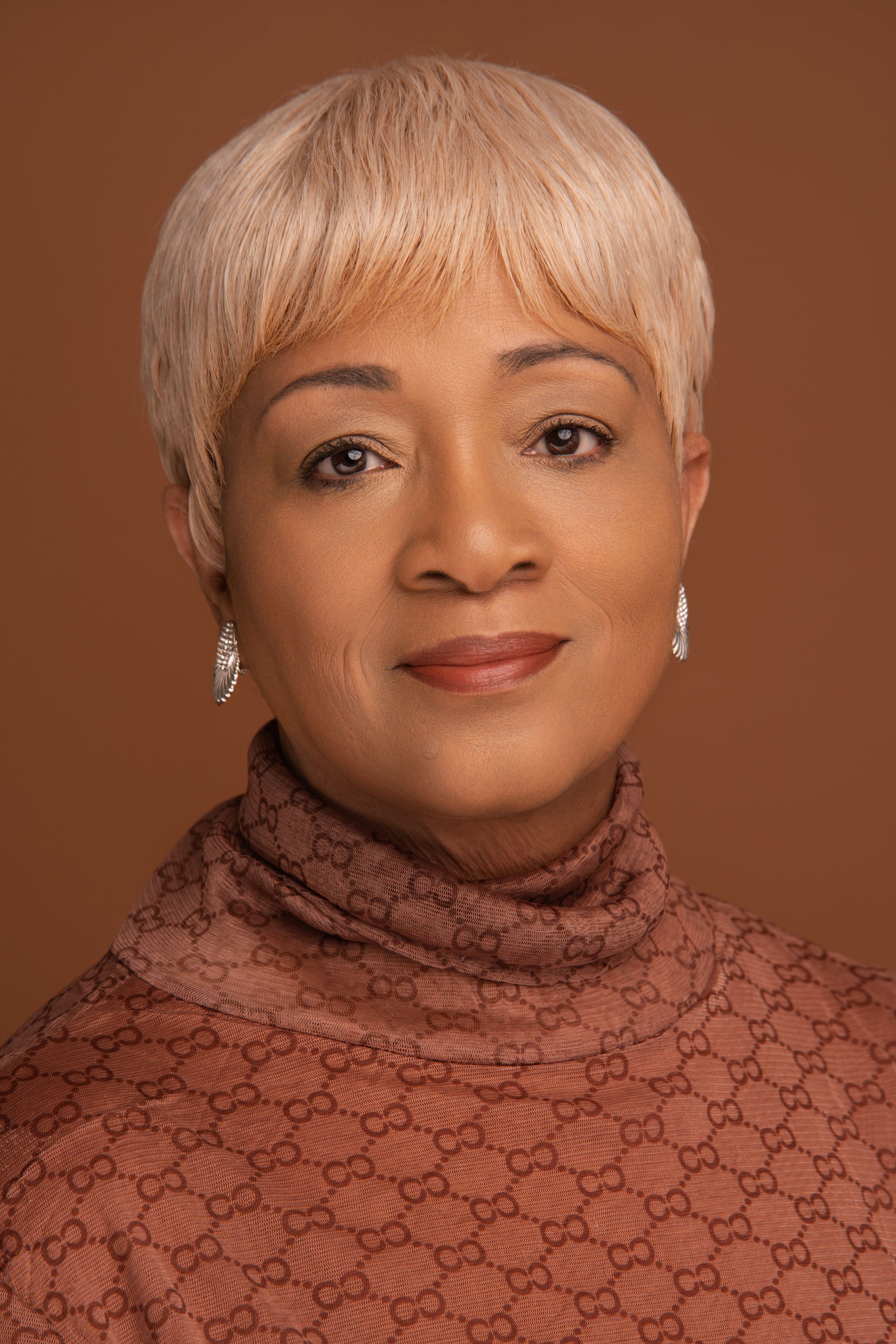Portrait series showing a person wearing a brown Gucci turtleneck sweater against a matching brown background.