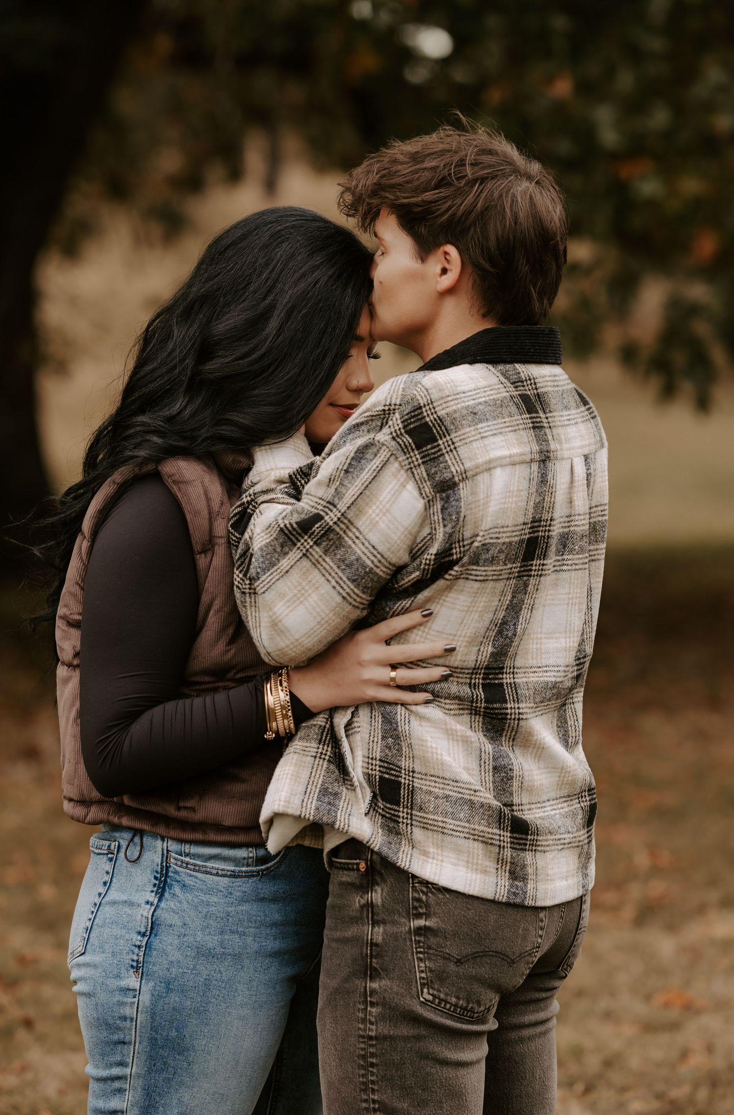 Intimate fall photography sequence showing tender moments between a couple in casual attire.