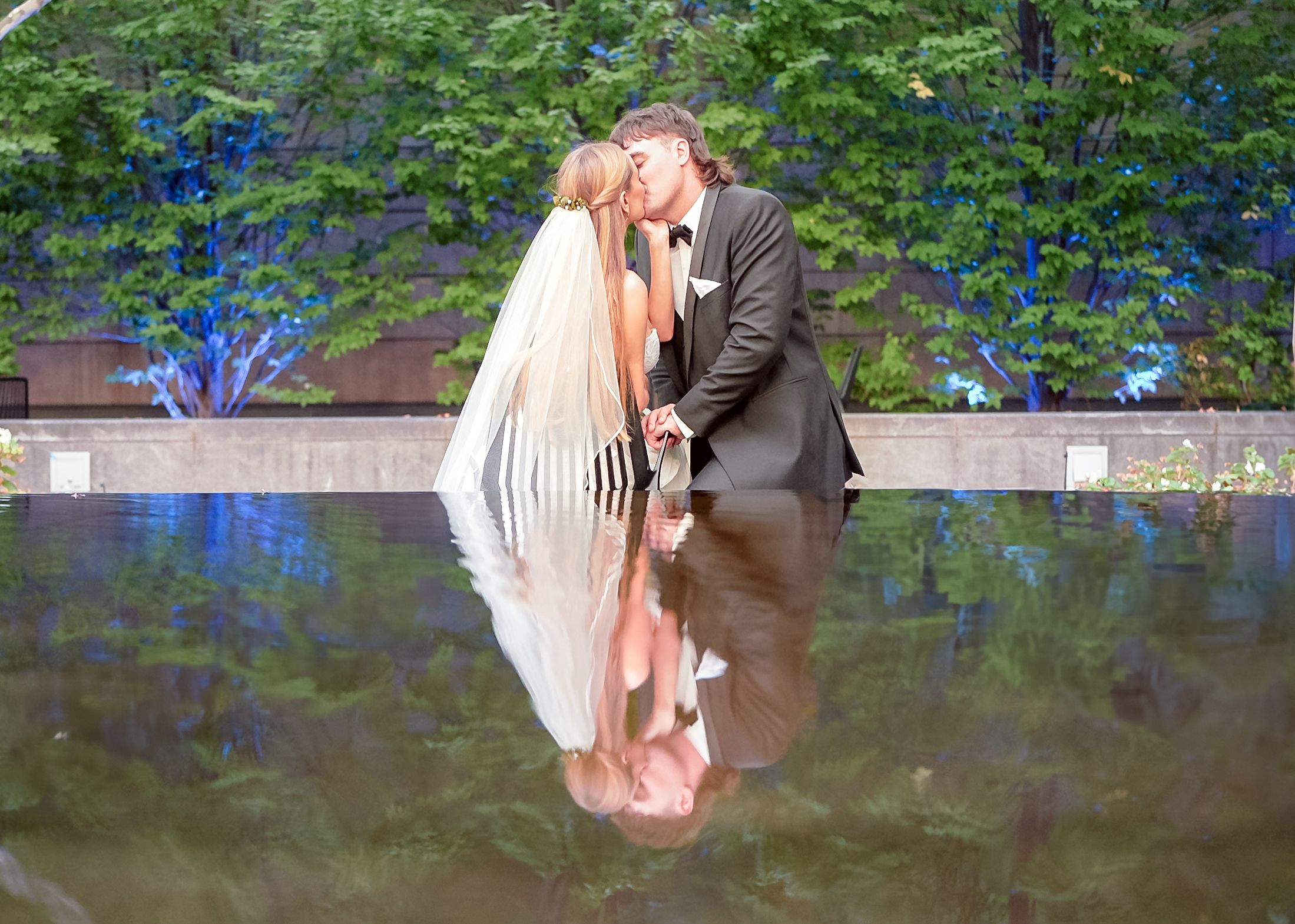 A couple shares a romantic moment during their wedding in Columbus Museum Of Art
