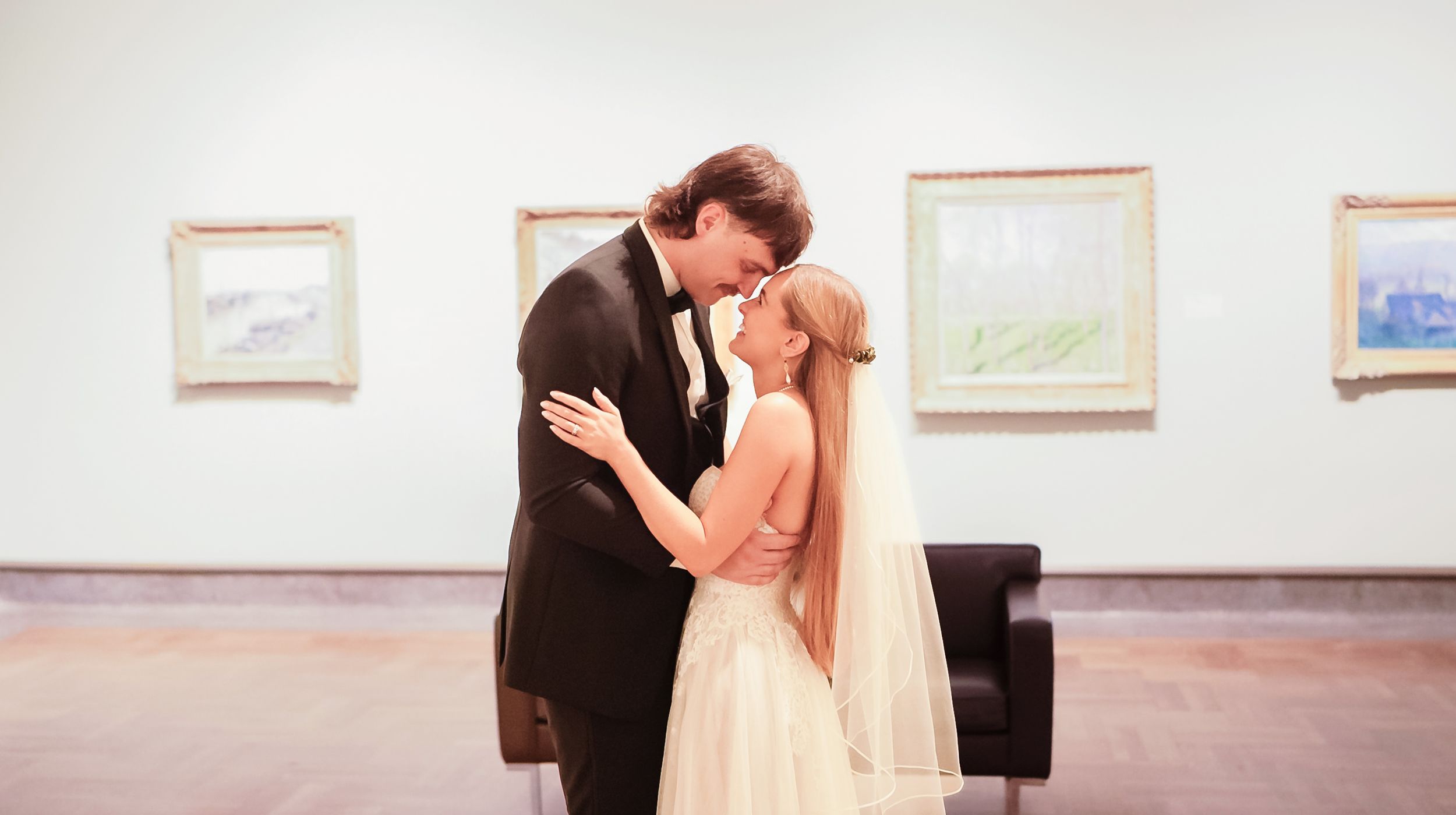 Couple dancing together in an art gallery in Columbus Museum Of Art