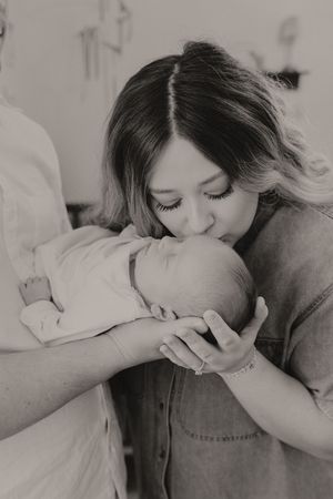 Black and white capture of a tender family moment.