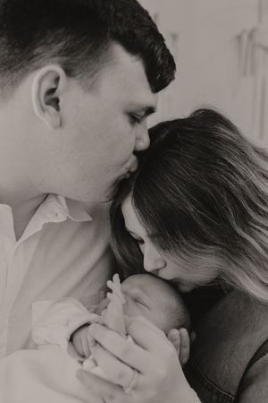 Intimate black and white portrait showing family affection.