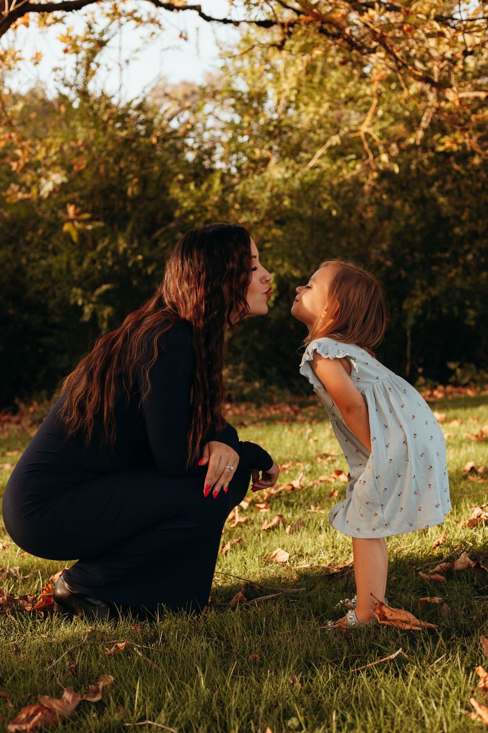 A series of candid moments between two people laying in a grassy field at golden hour.