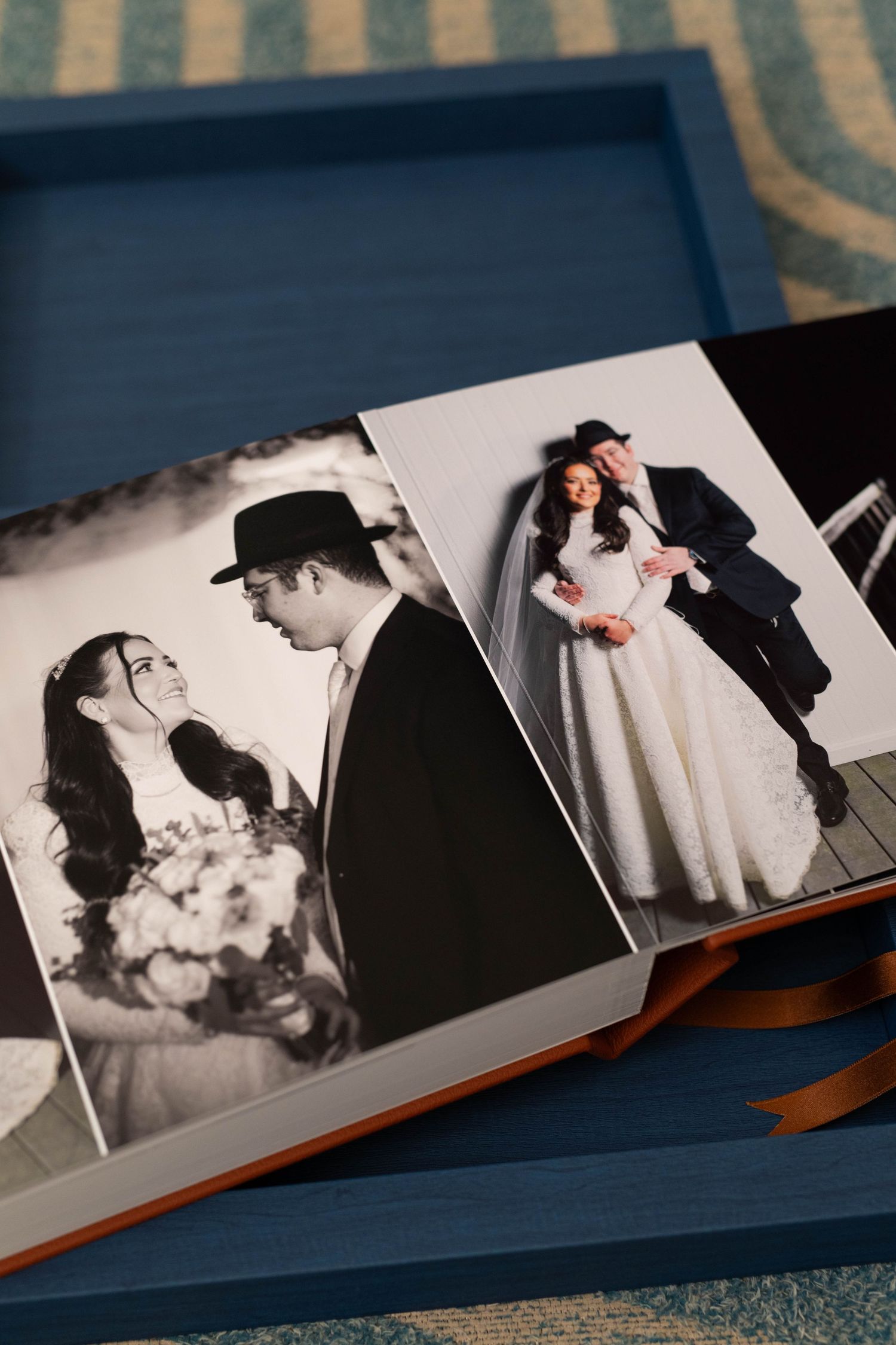 A series of vintage black and white wedding photos arranged in an album showing romantic moments between a couple.