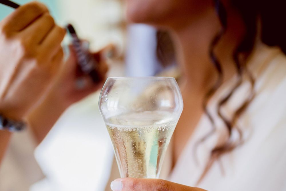 Close-up shots of champagne glasses being filled at an elegant celebration.