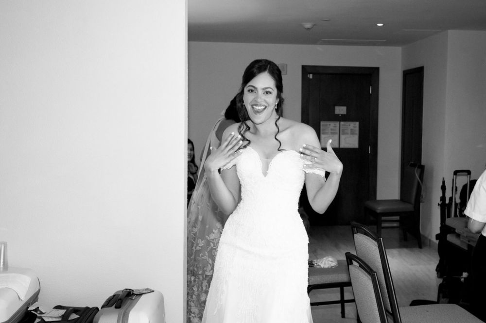 A black and white photo collage showing six different candid moments and expressions in an indoor setting.