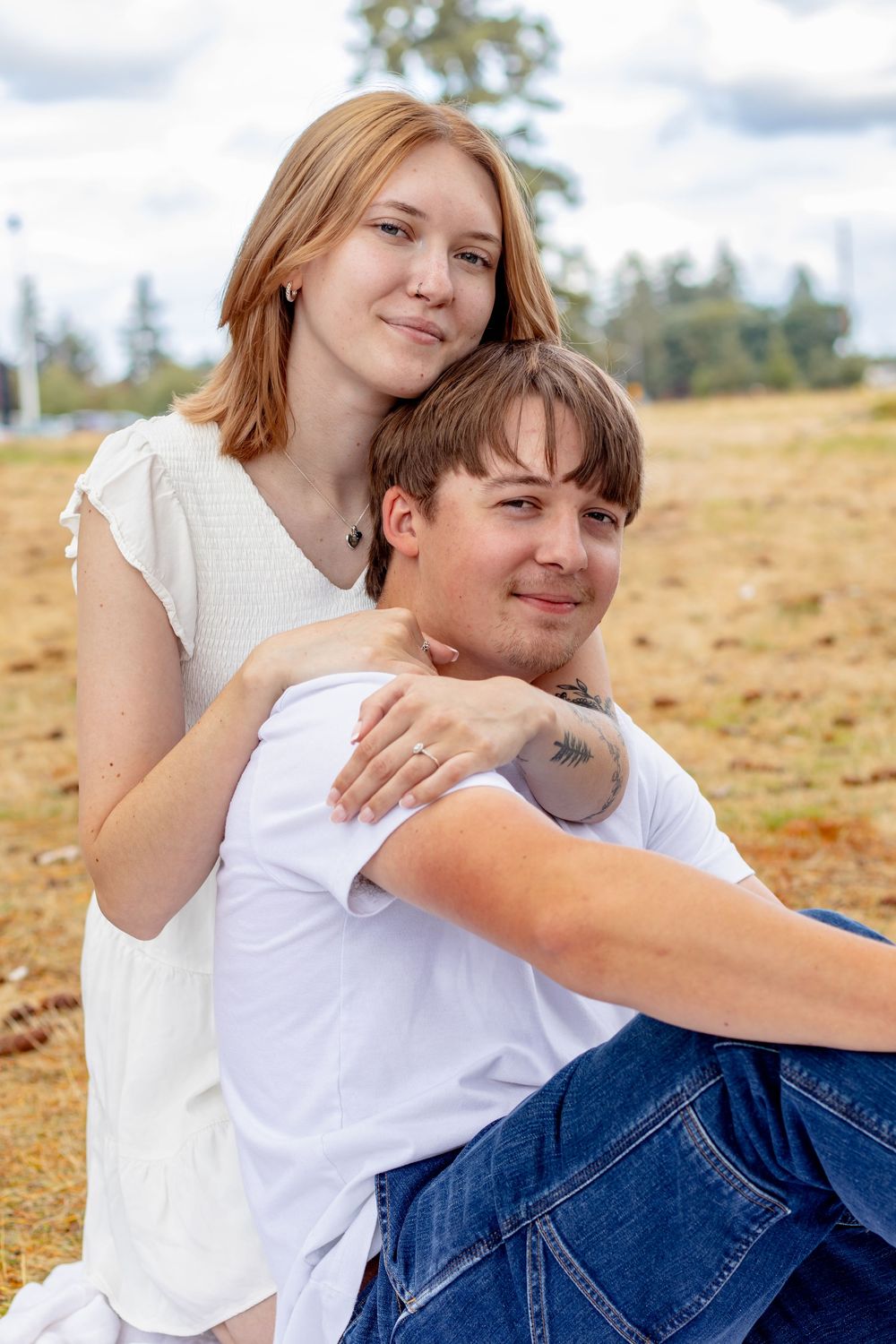 Newly engaged couple smiling