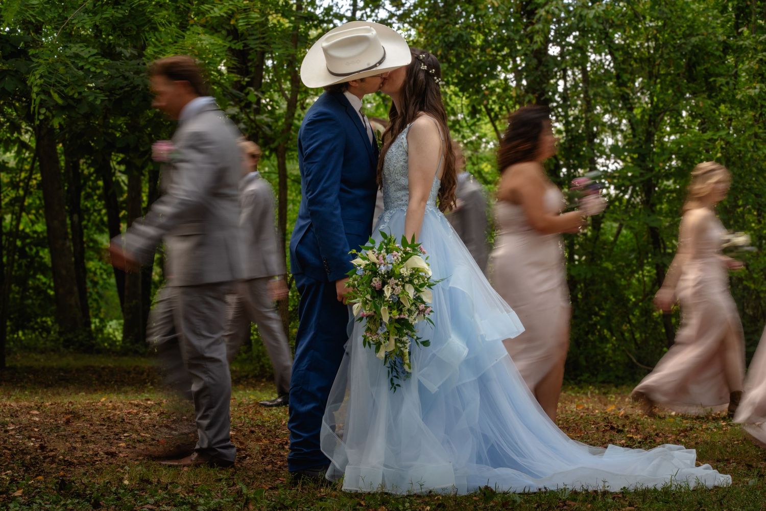 two people in love, both wearing glasses, staring lovingly at each other on their wedding day. Both are happy and excited.