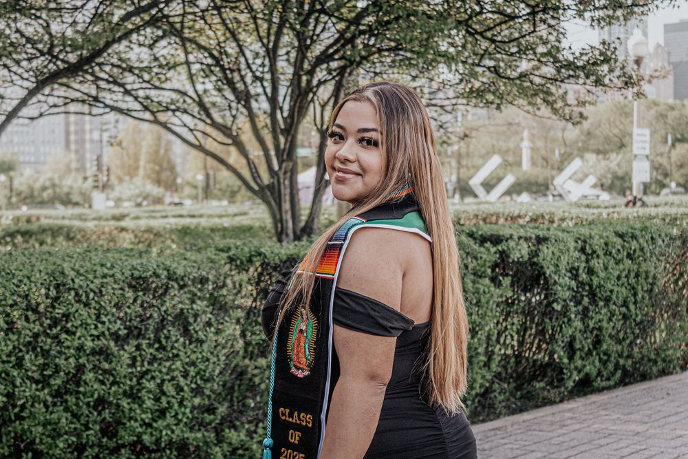 Outdoor graduation portraits with decorative stoles and regalia.
