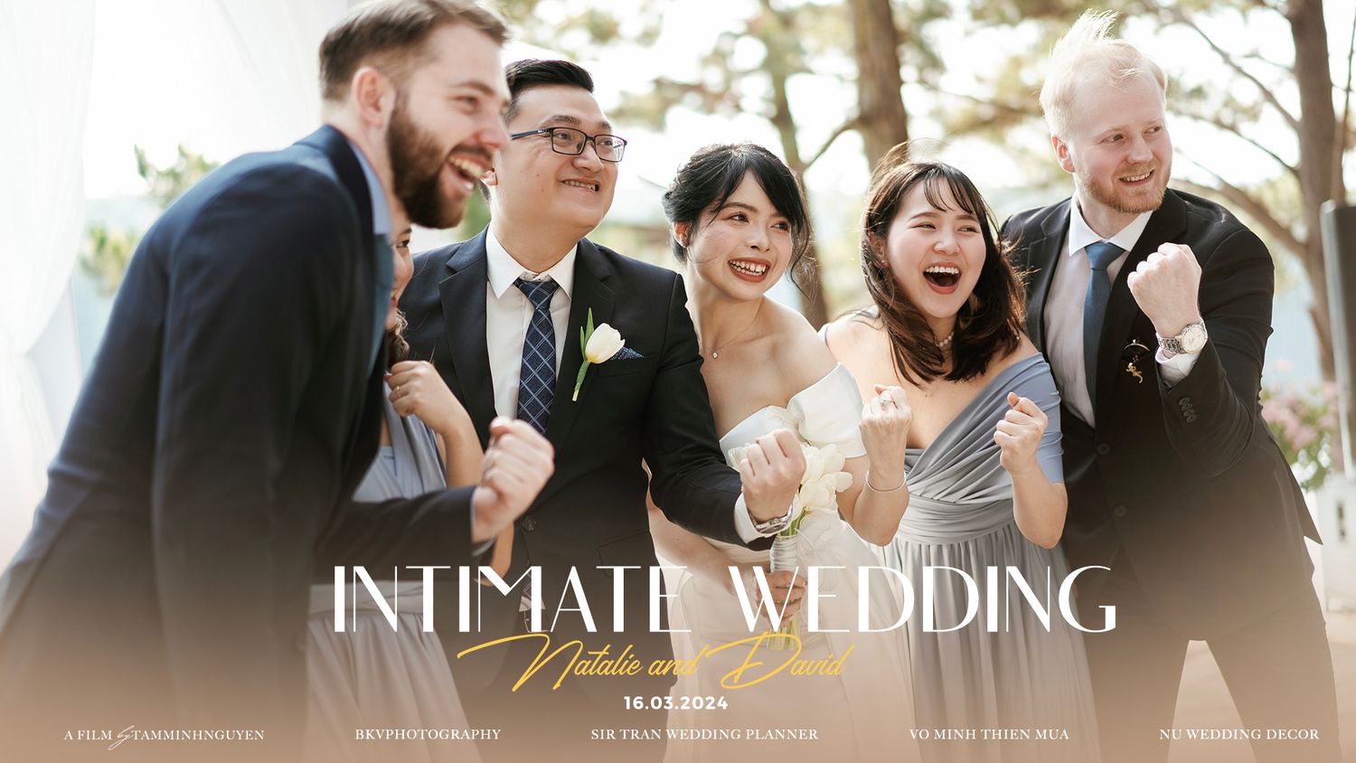 Group of wedding guests sharing a joyful candid moment at an intimate outdoor celebration.