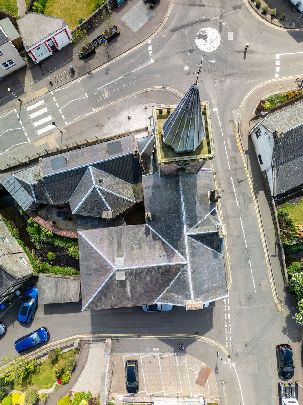 Bird's eye view of residential streets and intersections in a small town.