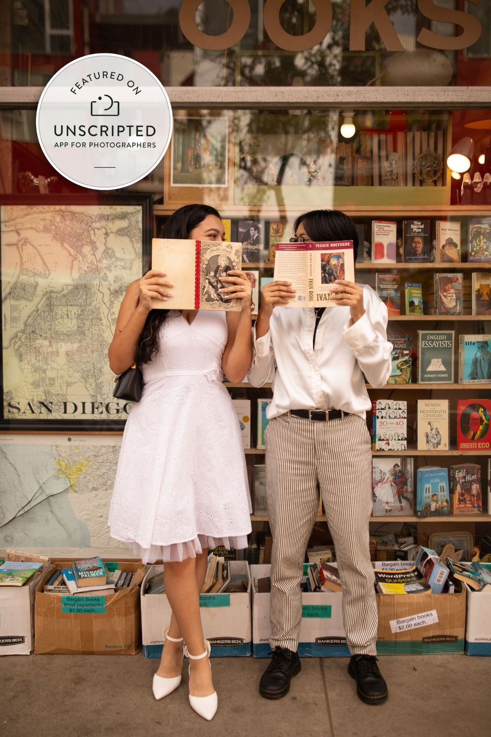A romantic engagement photo series taken at a bookstore showing couple's legs and white dress details against bookshelves.