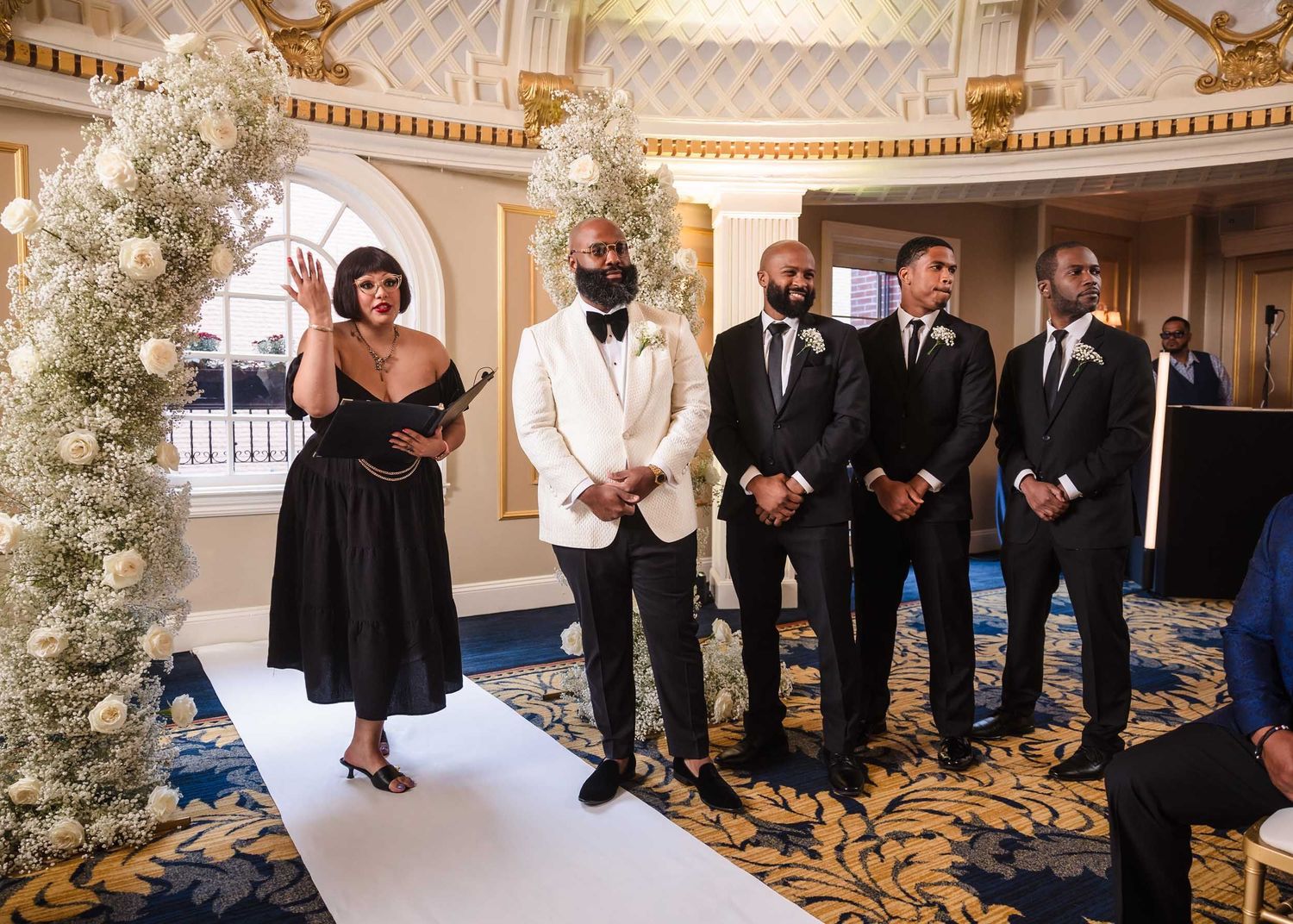Wedding ceremony in the Dome Room at Lenox Hotel Boston with groom and groomsmen at the altar
