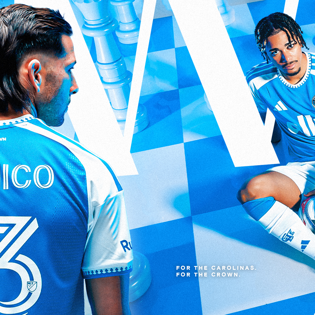 Two Charlotte FC players model the blue Carolina Kit with checkered design for the Carolinas.