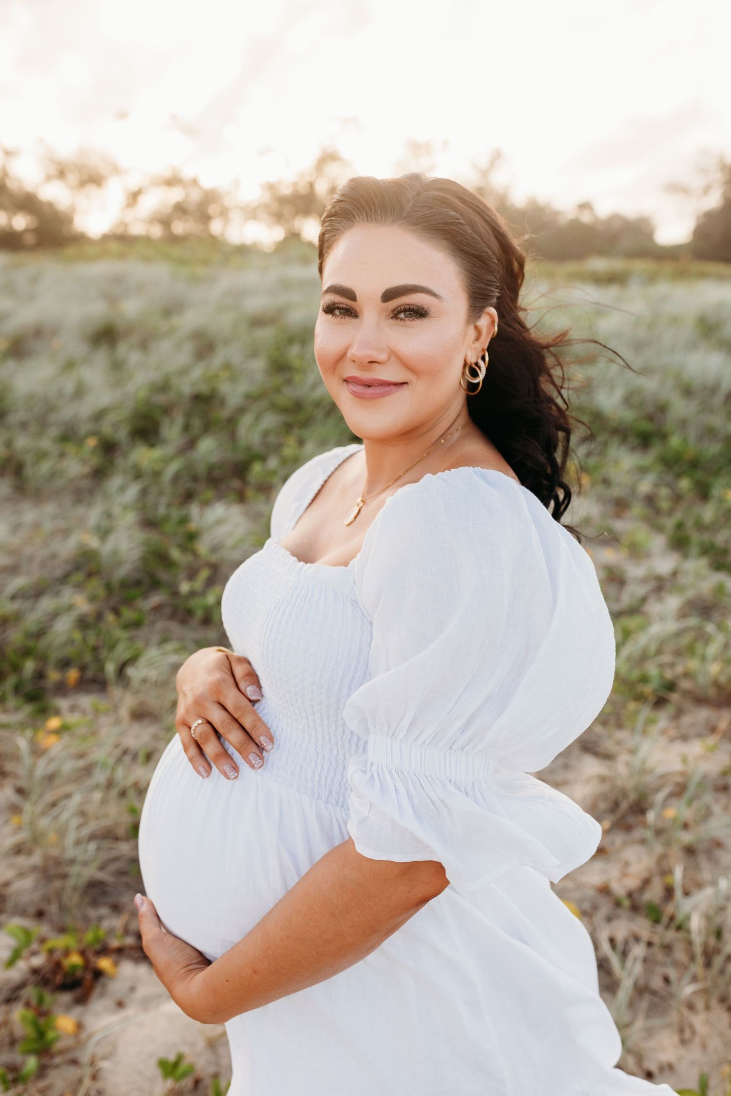 maternity photo shoot at a beach location