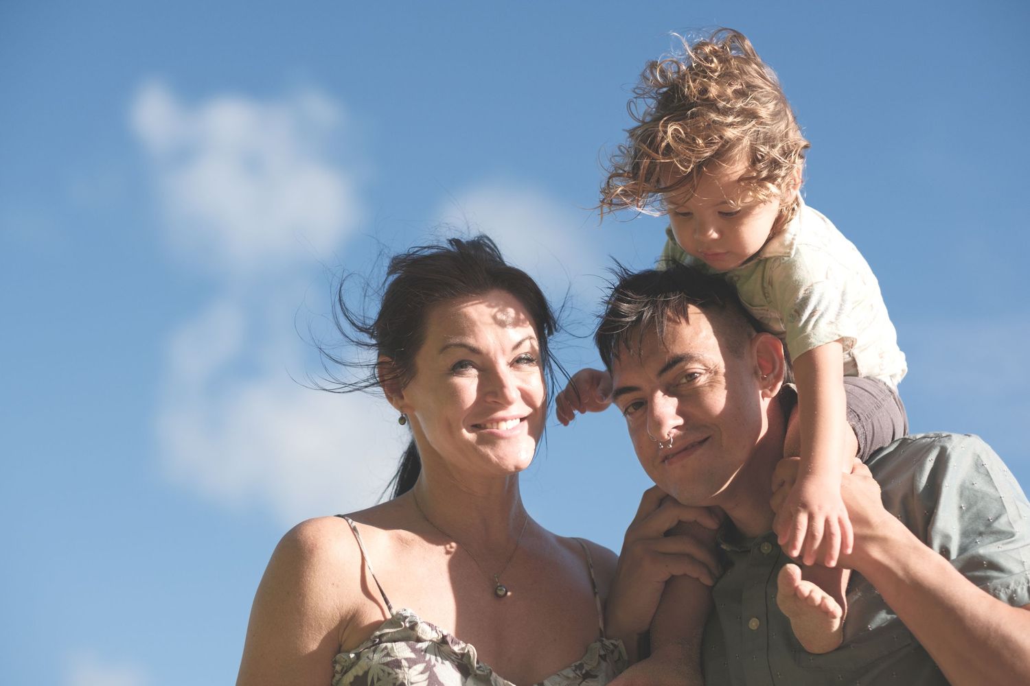 Happy family outdoors during a North Shore Oahu family photography session.
