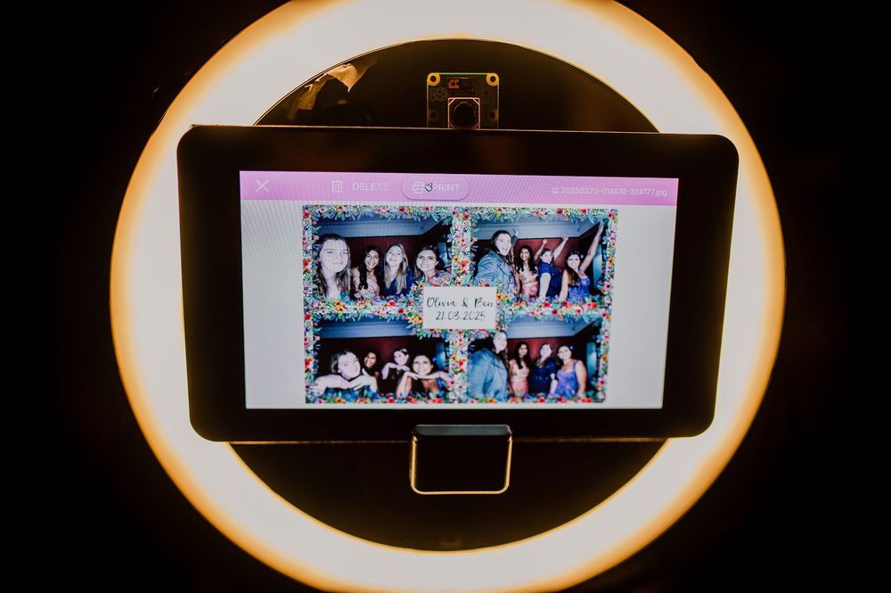 A series of four similar photos showing a panoramic display screen with figures in a dark setting.