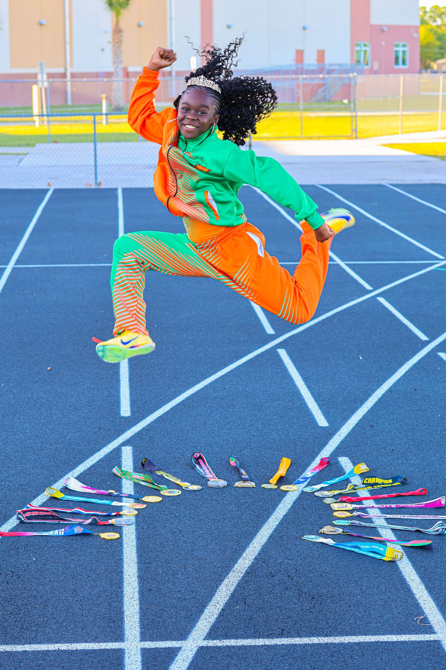 A sequence of dynamic dance moves captured on a blue track surface showing colorful shoes in motion.