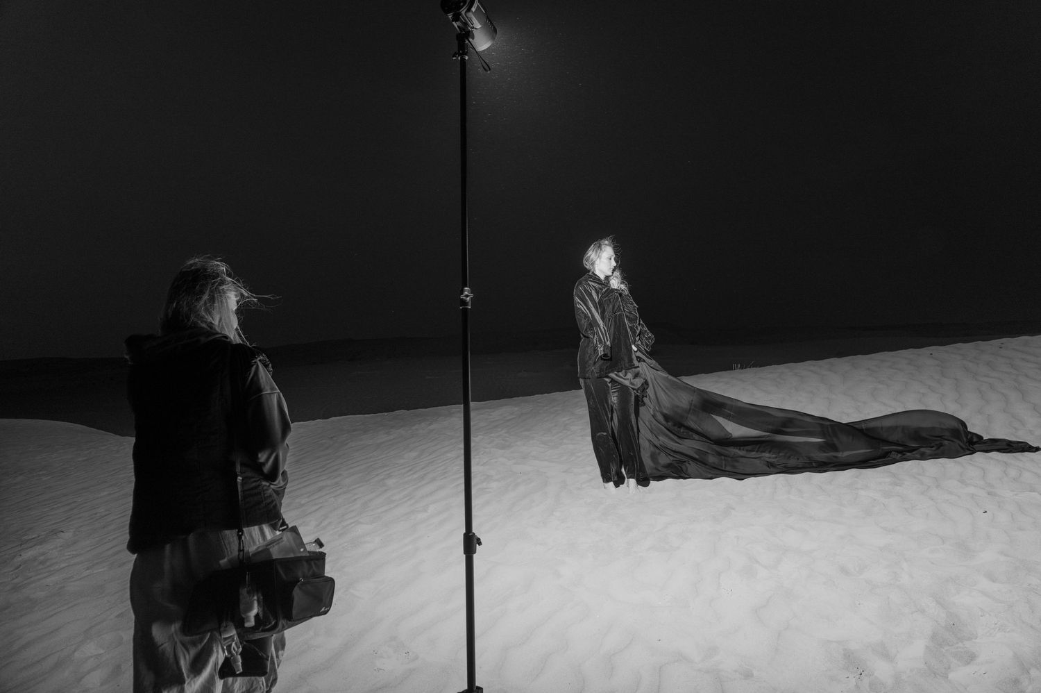 Desert photo session, with sand and wind.