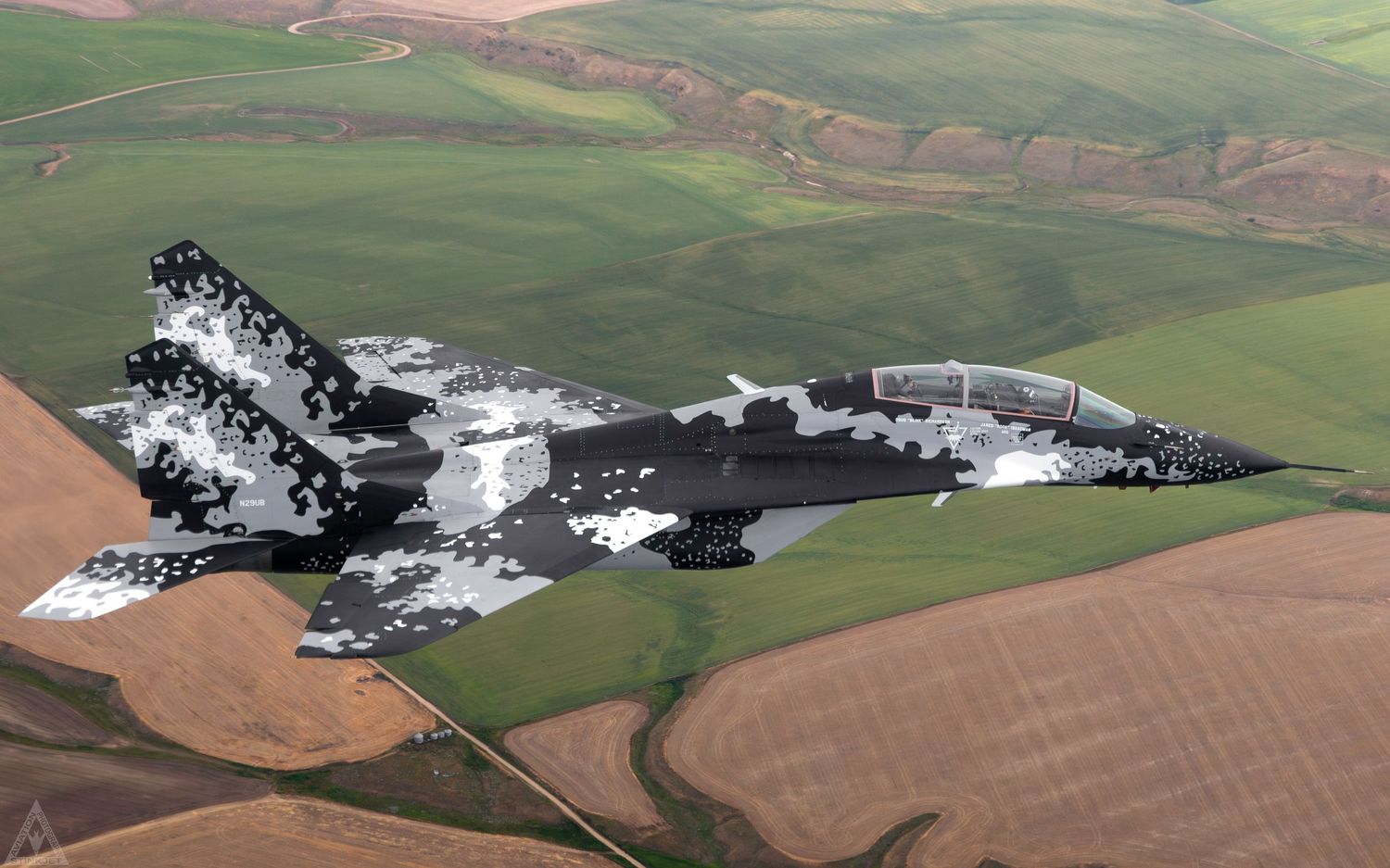 The world's only privately owned MiG-29 Flying above rural farmland