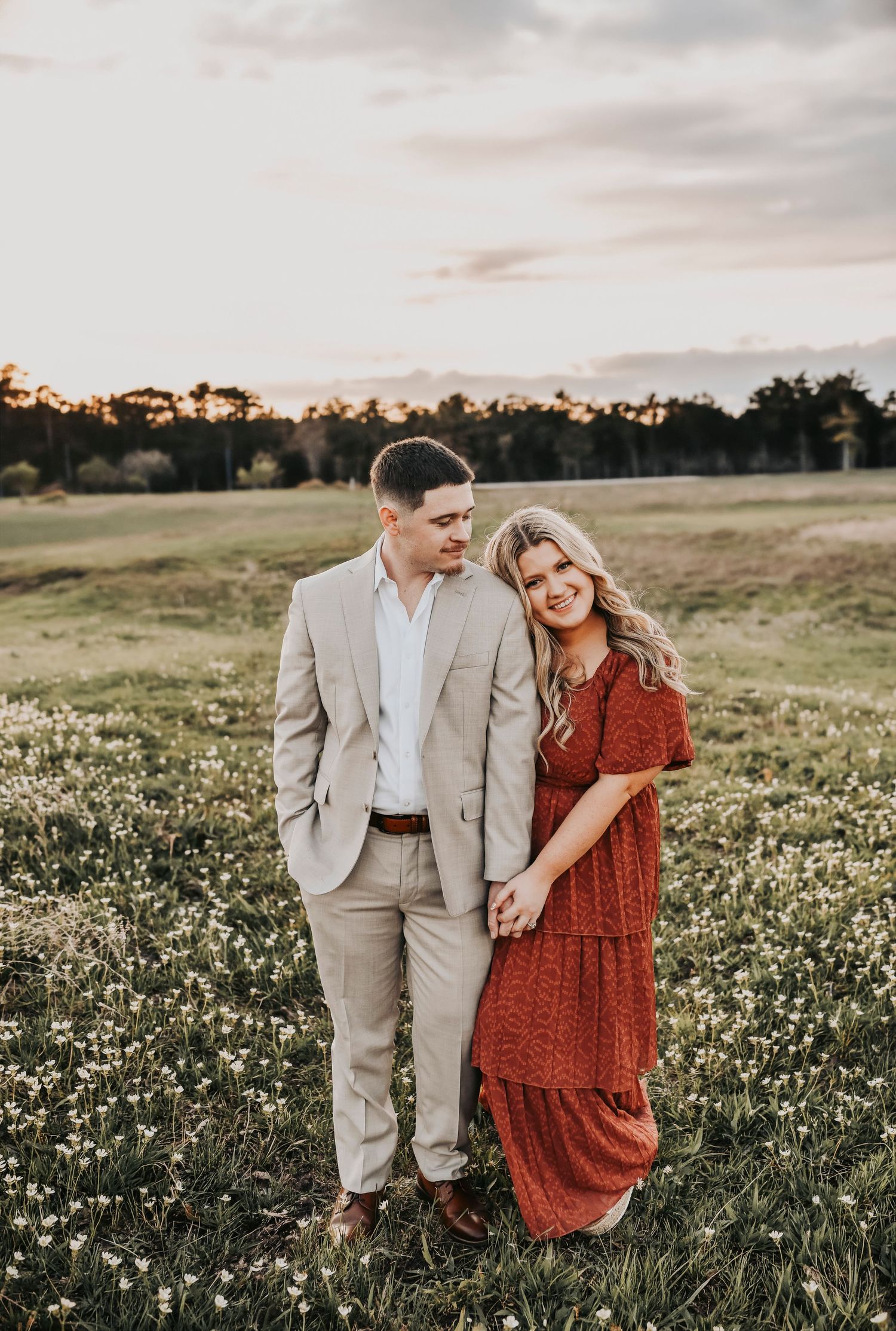 Couple hugging during Murrell Park engagement session at sunset.