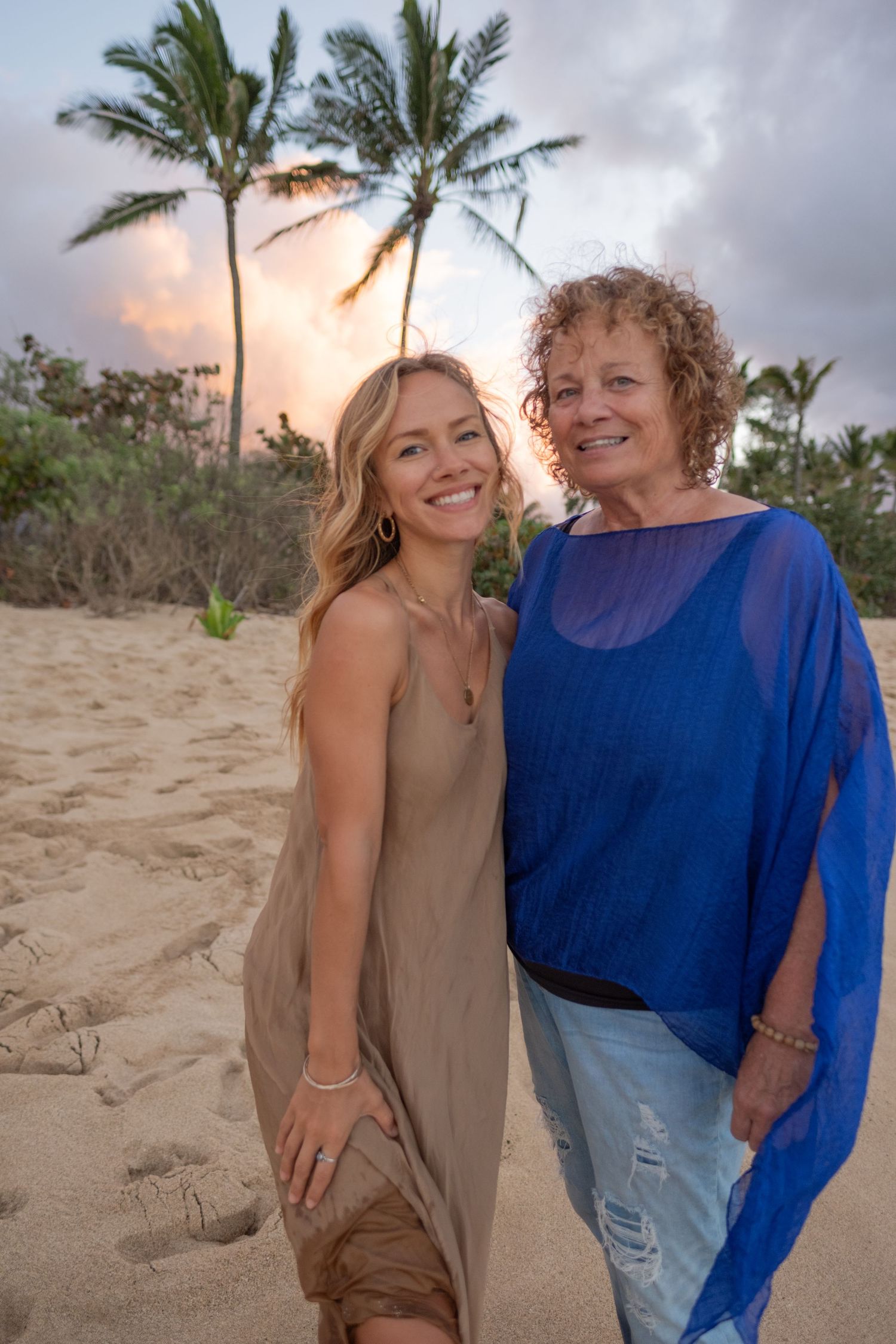 Mother and daughter smiling during a North Shore Oahu family photography session at sunset.