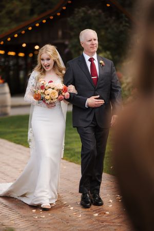 A sequence of wedding photos showing the couple's feet walking together on a brick pathway with autumn decorations.