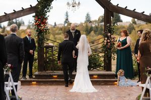A series of wedding ceremony photos taken at a rustic outdoor venue with floral decorations and wooden beams.