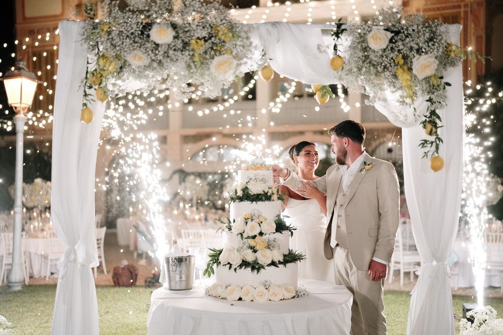 Sparkling cake cutting during an evening wedding at Villa Nobel in Sanremo