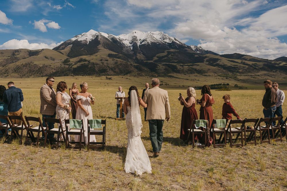 Bride entering her wedding under the Mountains in Pray Montana for her Intimate Wedding. Local Livingston, Pray Montana Wedding Photographer