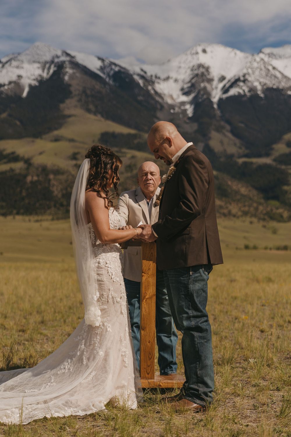 Bride & Groom Pray during their elopement out West in Paradise Valley Montana. Montana Wedding and Elopement Photographer in Paradise Valley