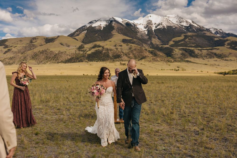 Groom Cries on his wedding day with his bride under the Mountains near Pray, Montana in Paradise Valley by Intimate elopement Photographer