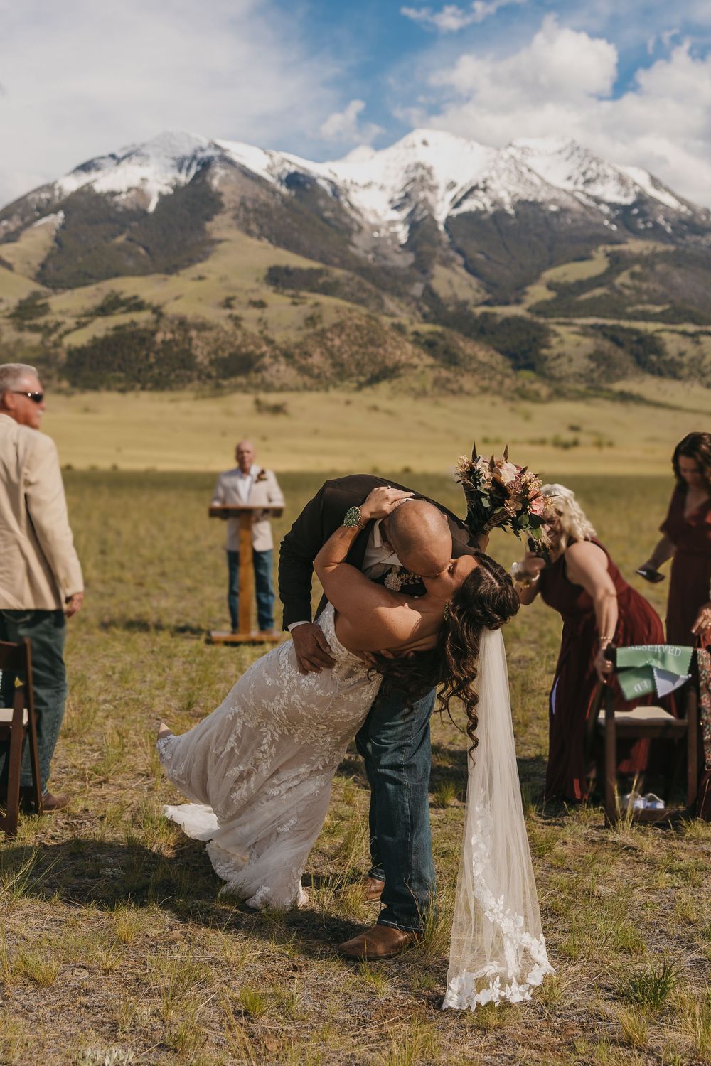 Western Bride & Groom dip kiss during their intimate Wedding in Pray, Montana near Emigrant by Local Livingston Elopement Photographer