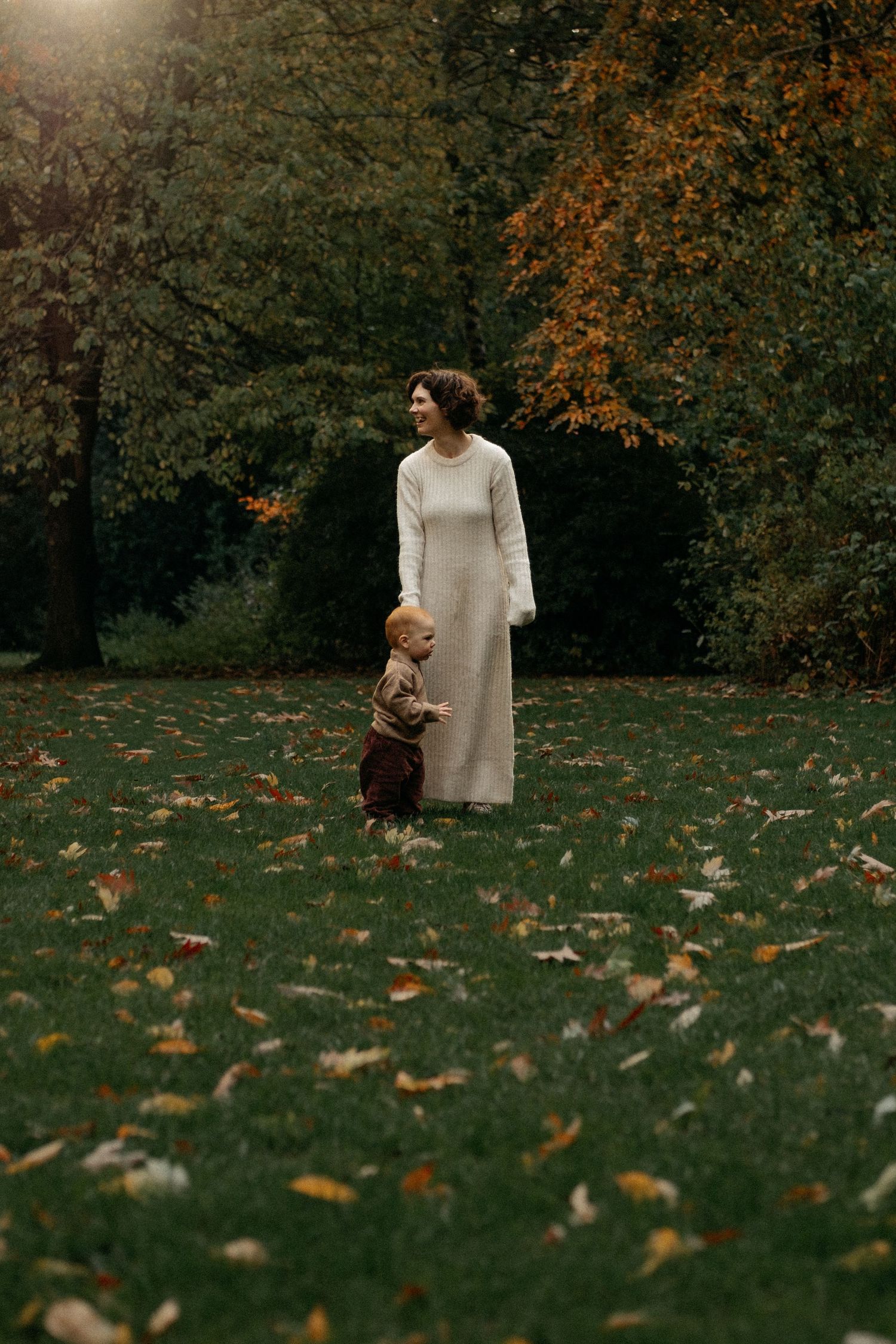 Mum standing in Jesmond dene during Autumn