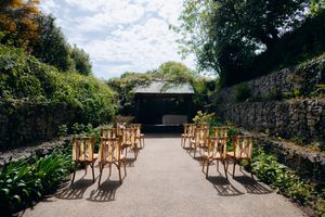 The Stack House wedding venue hidden garden ceremony setup.