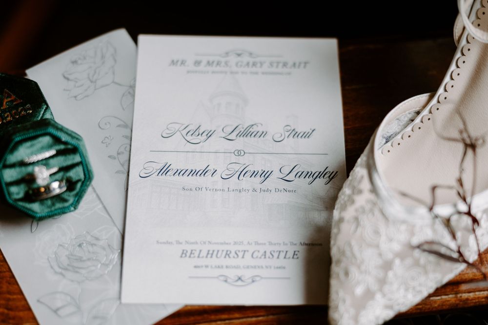 Elegant wedding invitation for Kelsey and Alexander at Belhurst Castle with lace bridal shoes.